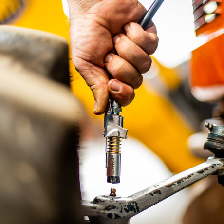 Låsebar hurtigkobling for fettpresse